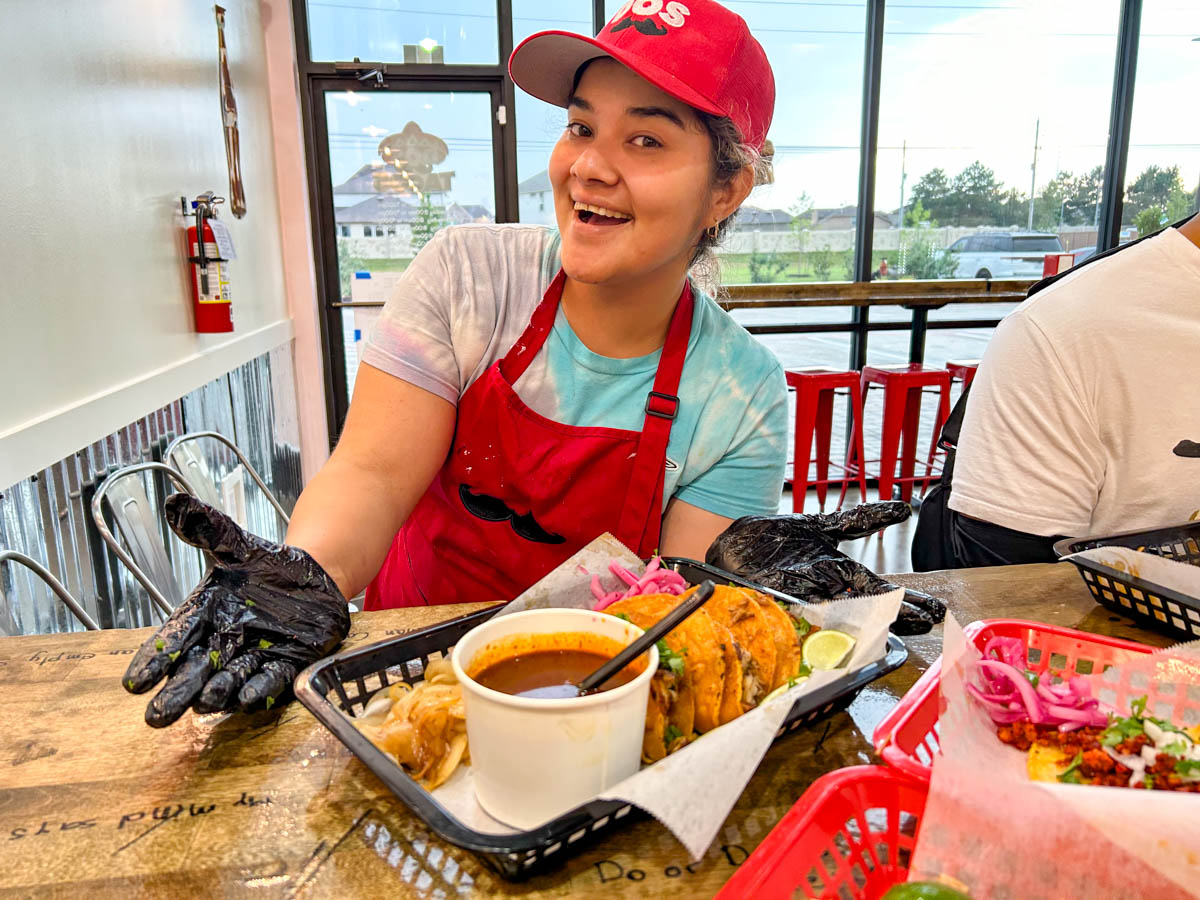 Employee serving quesabirrias