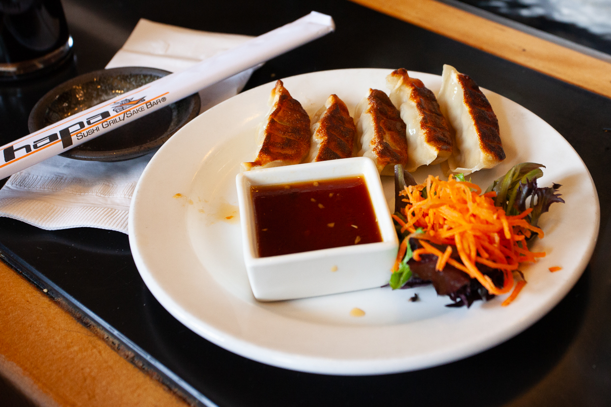 Ginger Pork Gyoza pot stickers with a spicy soy sauce.
