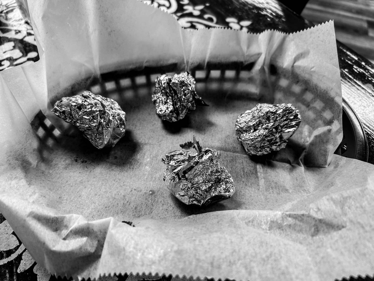 Four empty foil balls