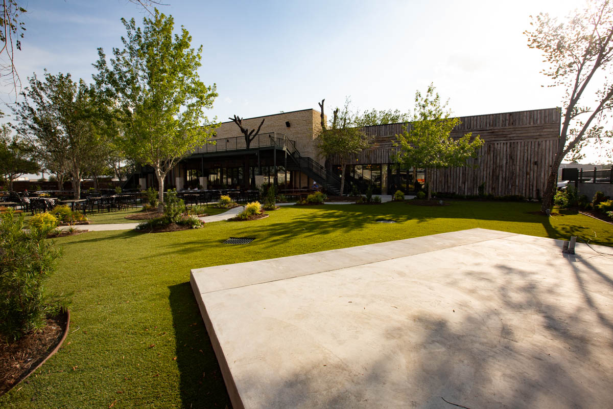 Large concrete outdoor stage area at Katy Beer Garden